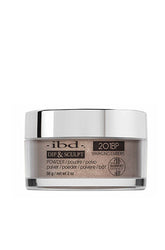 A transparent 2 ounce glass tub containing ibd Dip & Sculpt Sparkling Embers nail dip powder