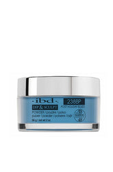 A 2 ounce glass tub of ibd Dip & Sculpt Post Holiday Blues nail powder dip