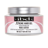 A jar of IBD Xtreme Hard Gel LED/UV Builder Gel in the shade Rose Luster, featuring a pink and white label with a silver lid on a white background.
