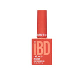 IBD Nectar Rubber Gel in a vibrant coral red bottle, ideal for bold, juicy summer nail styles.