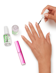Applying NailTek Hydrate treatment on nails with NailTek Strengthen and crystal file nearby.