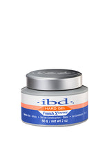A 2-ounce grey plastic container of ibd UV Xtreme White Builder Gel with silver twist cap