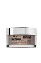 A transparent 2 ounce glass tub containing ibd Dip & Sculpt Sparkling Embers nail dip powder