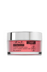 A 2-ounce glass tub of ibd Dip & Sculpt with Inky Pinky color variant of a nail powder dip