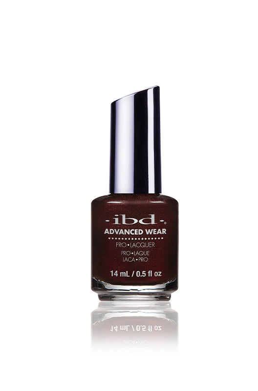 IBD Advanced Wear polish in Bustled Up, a molten burgundy shimmer with volcanic intensity and bold shine.