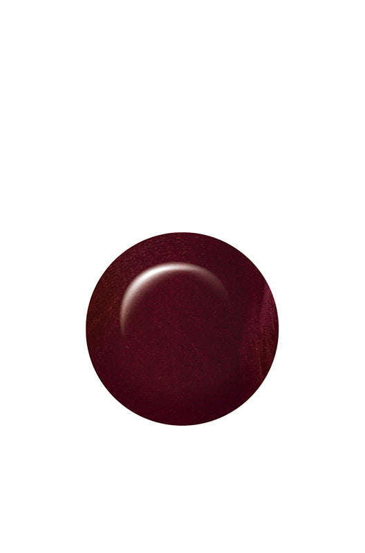 Swatch of IBD Bustled Up, a dark burgundy shimmer with a touch of red sparkle for a fiery, smoldering look.