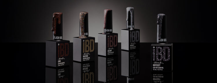 Five bottles of IBD lacquers on a dark background 