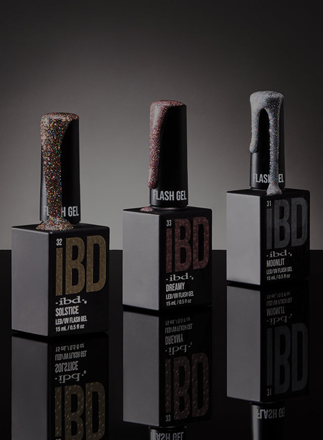 Five bottles of IBD lacquers on a dark background 