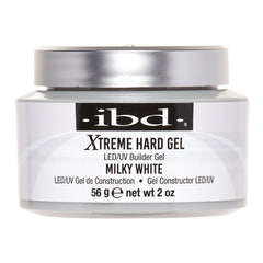 A jar of IBD Xtreme Hard Gel LED/UV Builder Gel in Milky White, featuring a white body, a metallic silver lid, and a black label with white text.