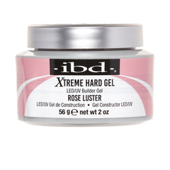 A jar of IBD Xtreme Hard Gel LED/UV Builder Gel in the shade Rose Luster, featuring a pink and white label with a silver lid on a white background.