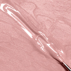 A close-up of IBD Xtreme Hard Gel LED/UV Builder Gel in the shade Champagne Sparkle
