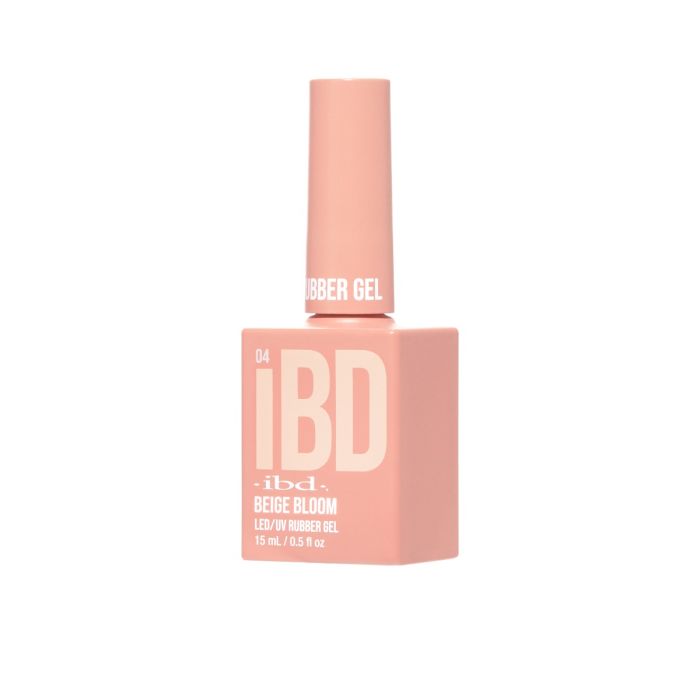 IBD Beige Bloom Rubber Gel bottle angled view in a muted blush pink, great for versatile everyday nail looks.