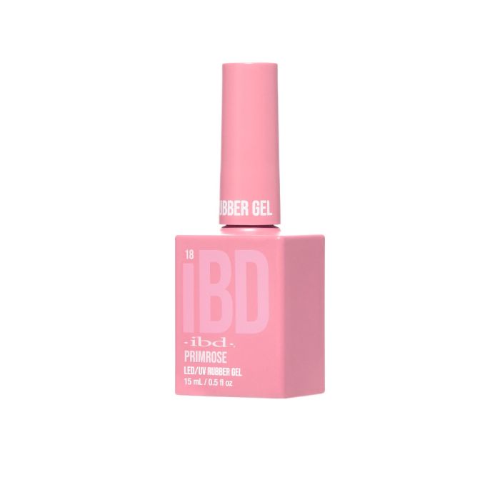 Angled view of IBD Rubber Gel Primrose bottle, showcasing its light pastel pink color and modern matte look.