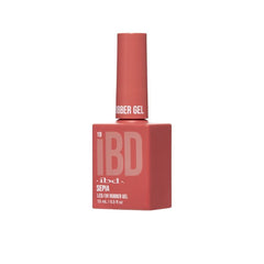 Side view of IBD Rubber Gel Sepia bottle showcasing its bold terracotta-red hue.